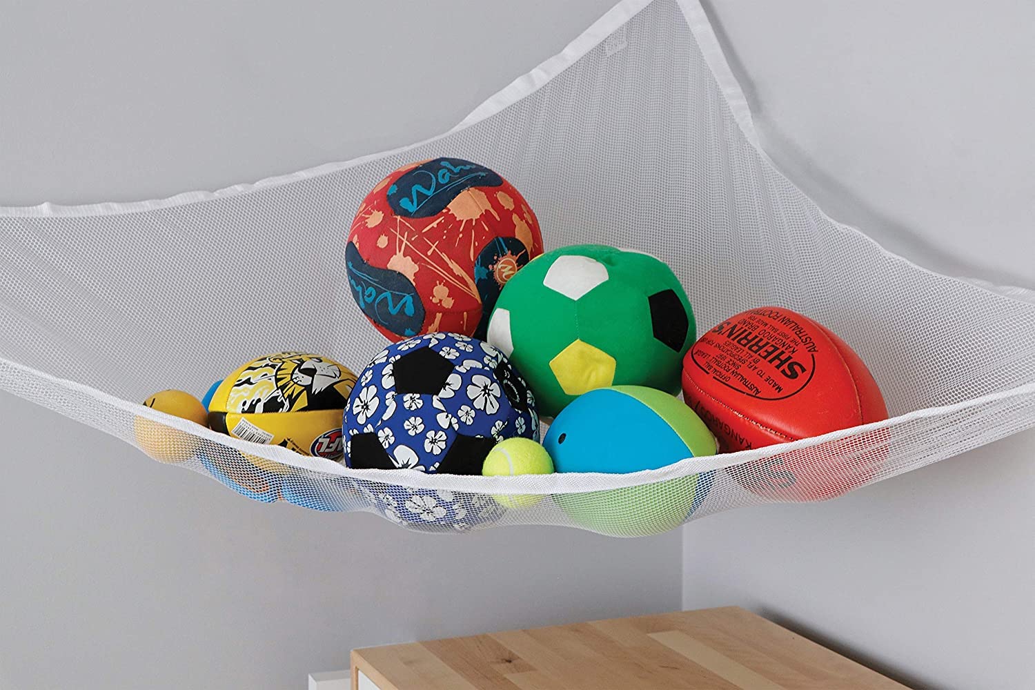 Little Chicks jumbo net plushie storage in a cozy bedroom corner