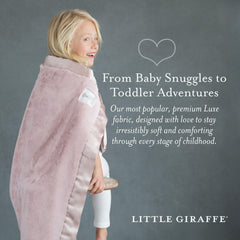 Close-up of Little Giraffe Luxe blanket showing plush faux fur and satin edge.