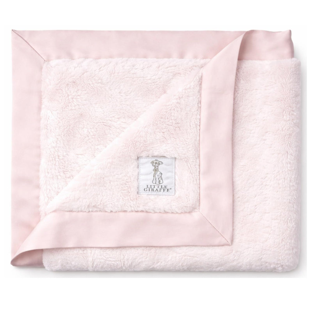 Little Giraffe Luxe soft blanket in pink with satin trim for cozy warmth on the go.