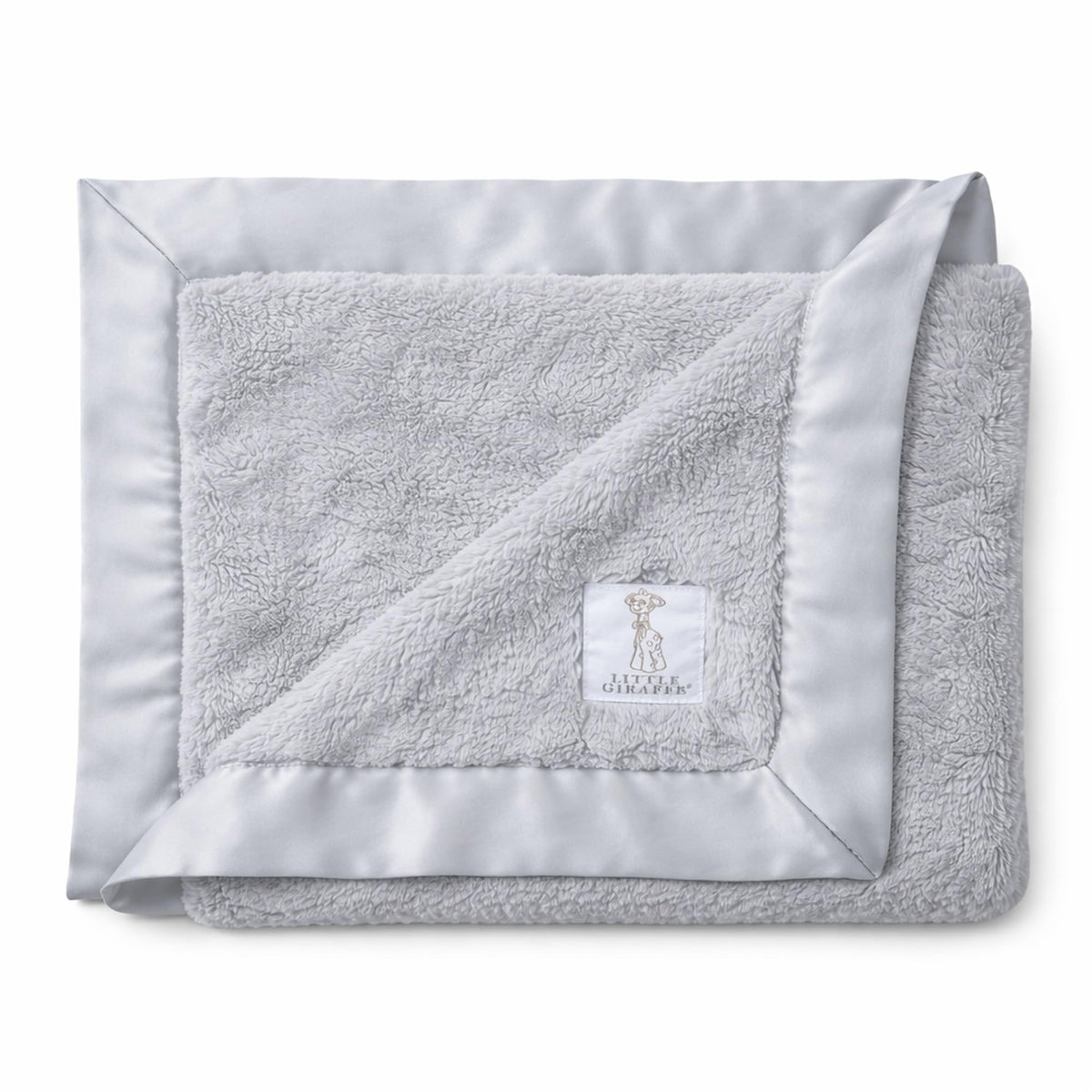 Little Giraffe Luxe Soft Blanket with satin trim for gentle newborn warmth.