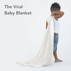 Little Giraffe Posh Mink baby blanket crib drape adds cozy style and warmth.