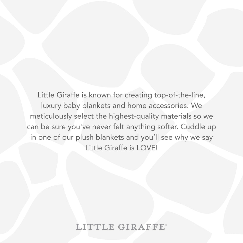 Little Giraffe Posh Mink baby blanket plush texture shown with satin edge.