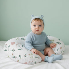 Little Grape Land pink solid nursing cover complements nursery decor.