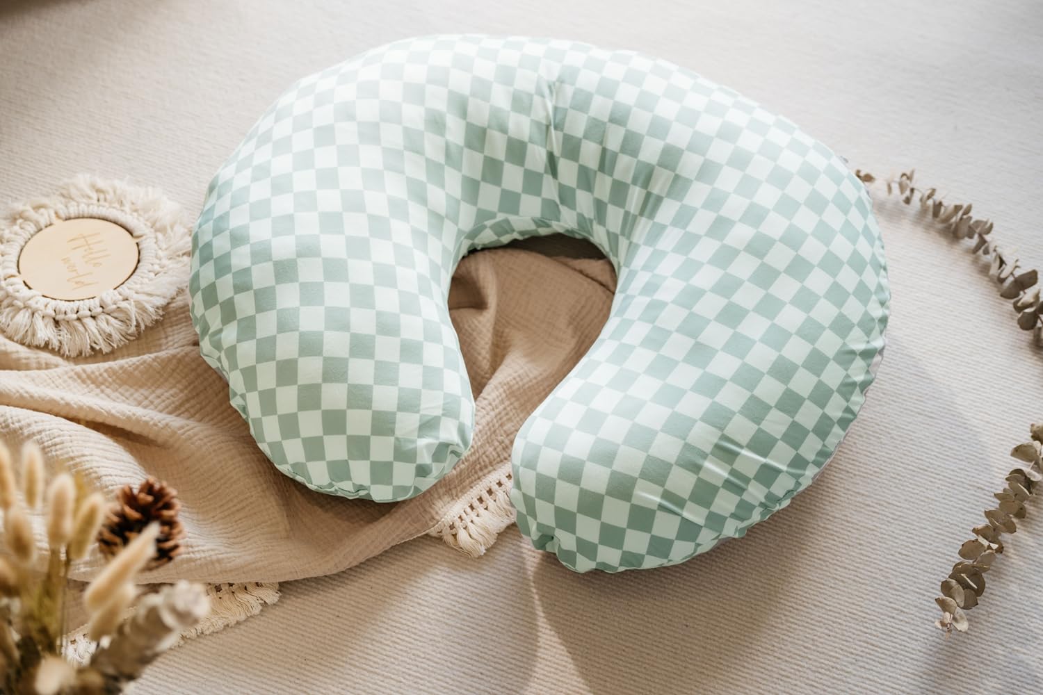 Little Jump coffee checkered nursing cover provides snug fit for pillows.