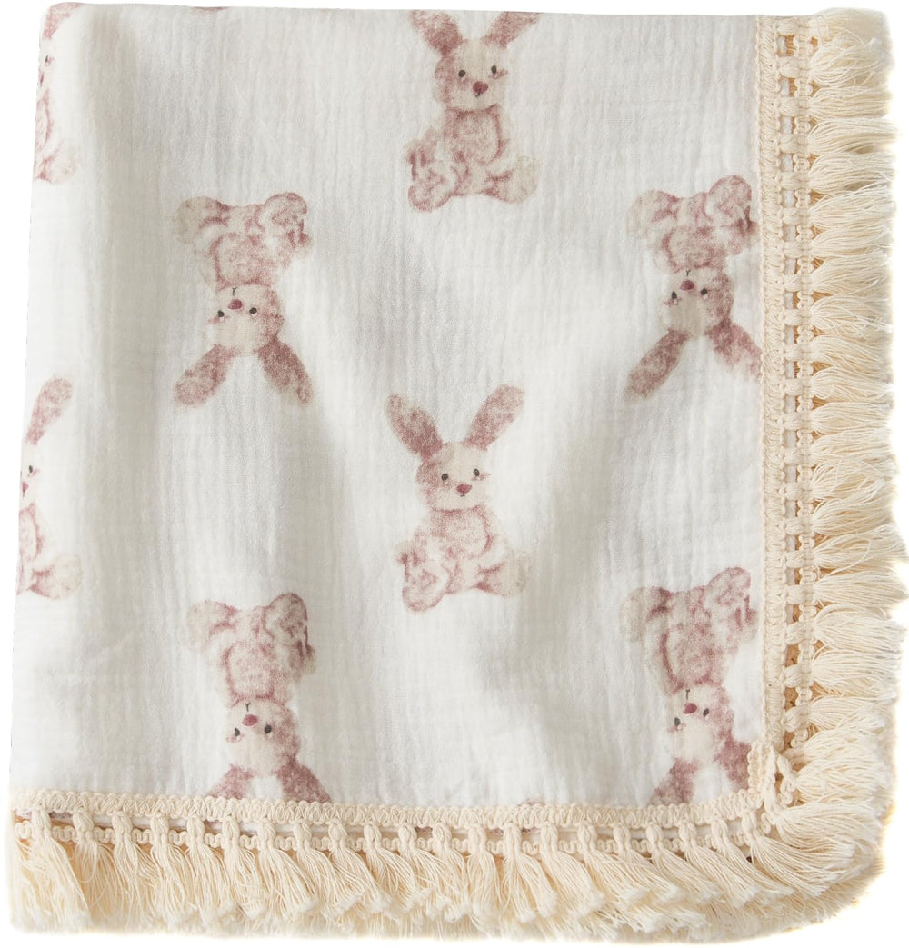 Little Jump cotton muslin swaddle blanket tassel detail for soft, breathable cuddles.