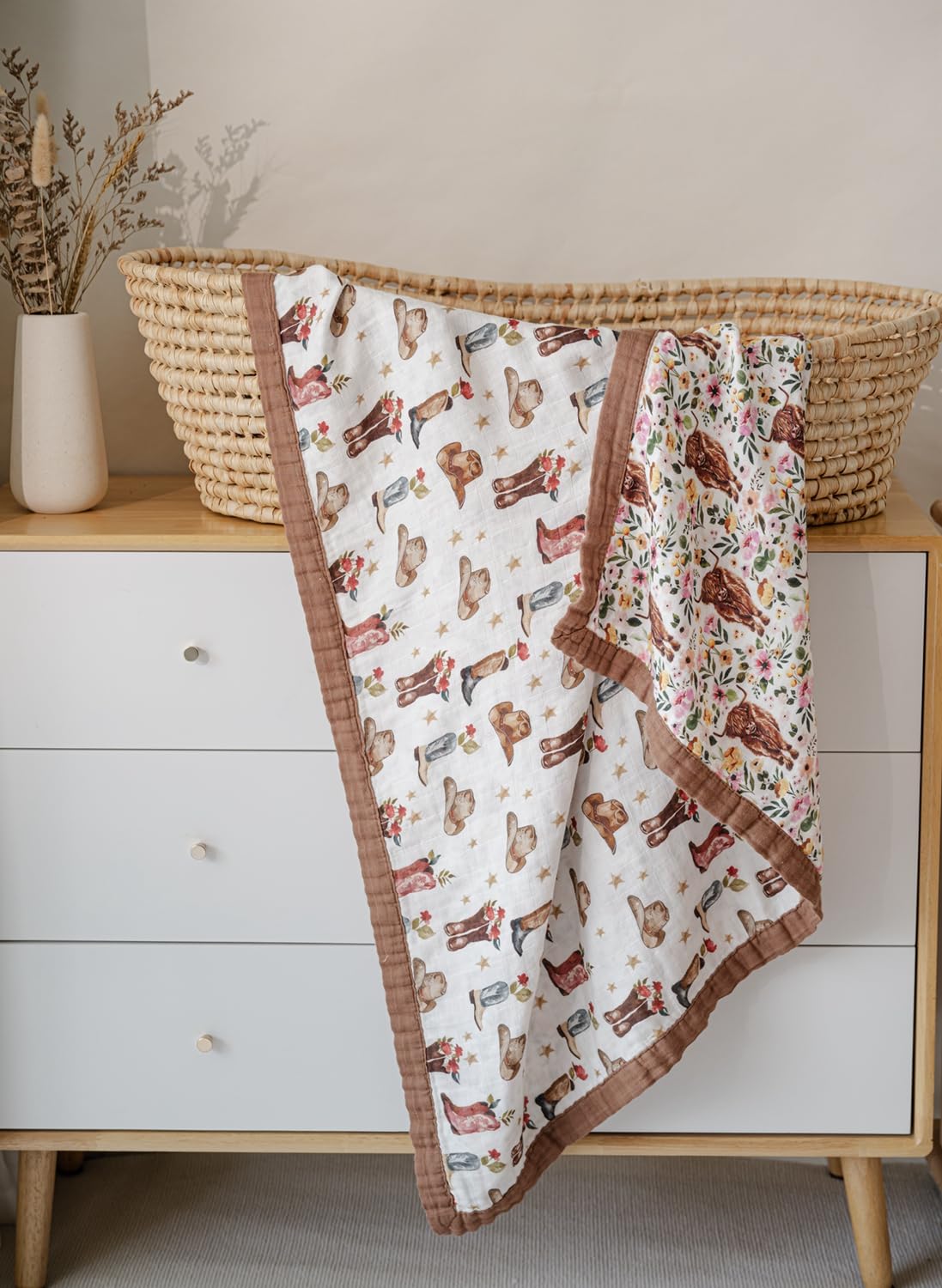 Little Jump cowgirl floral Highlandcow muslin blanket in stroller during outdoor outing.