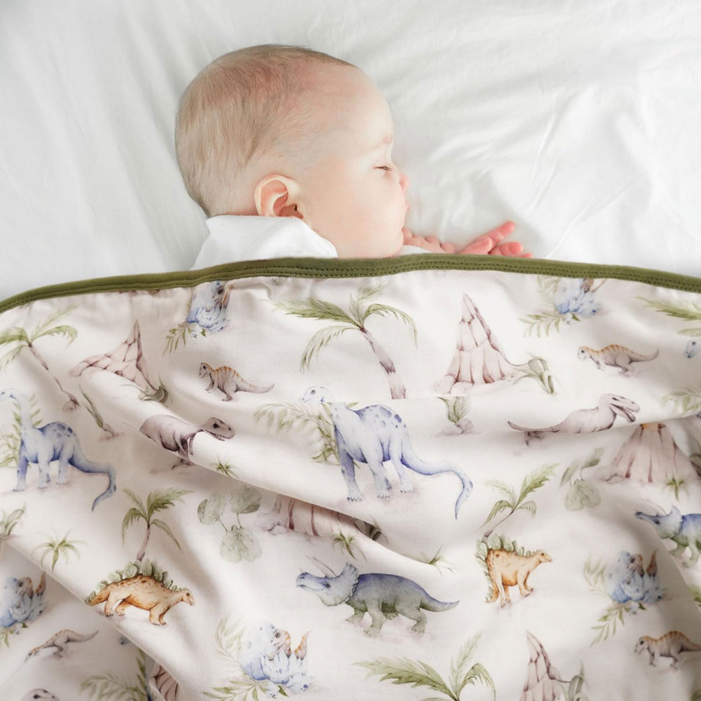 Little Jump Dinosaur Muslin Blanket cozy baby quilt for naptime.