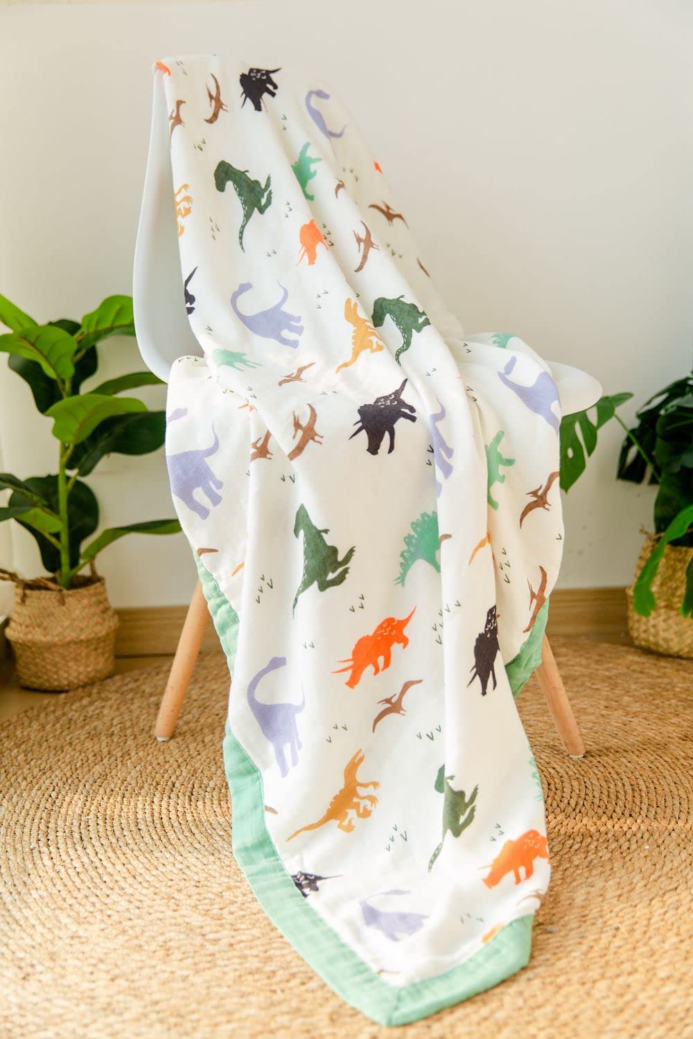 Little Jump Dinosaur Muslin Blanket for daycare, large enough for quick swaddles.