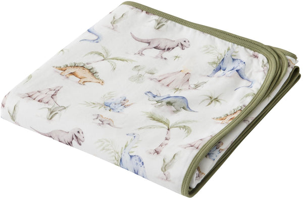 Little Jump Dinosaur Muslin Blanket fabric closeup showing soft cotton texture for baby's skin.