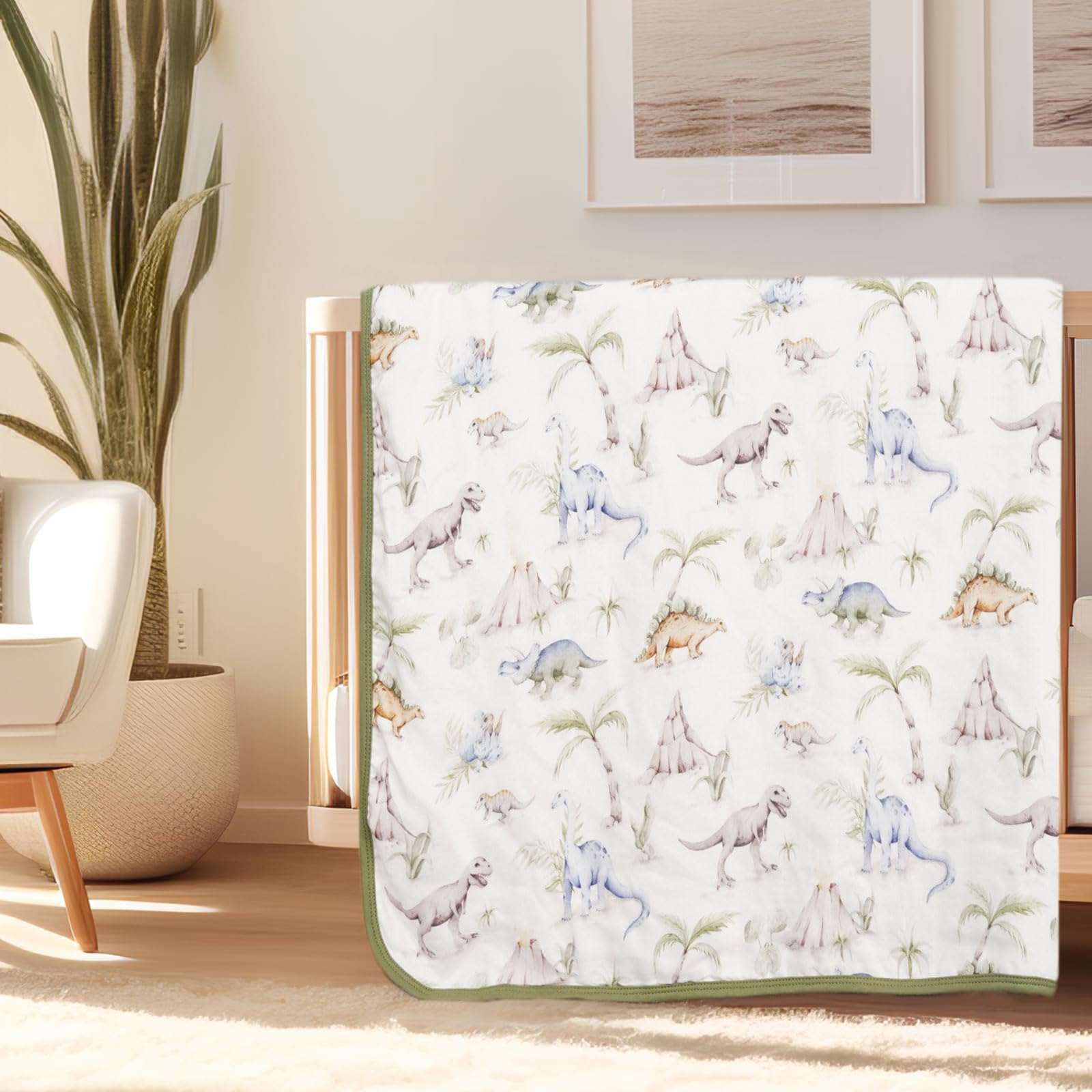 Little Jump Dinosaur Muslin Blanket large 47x47 inches shown as roomy toddler bed cover.