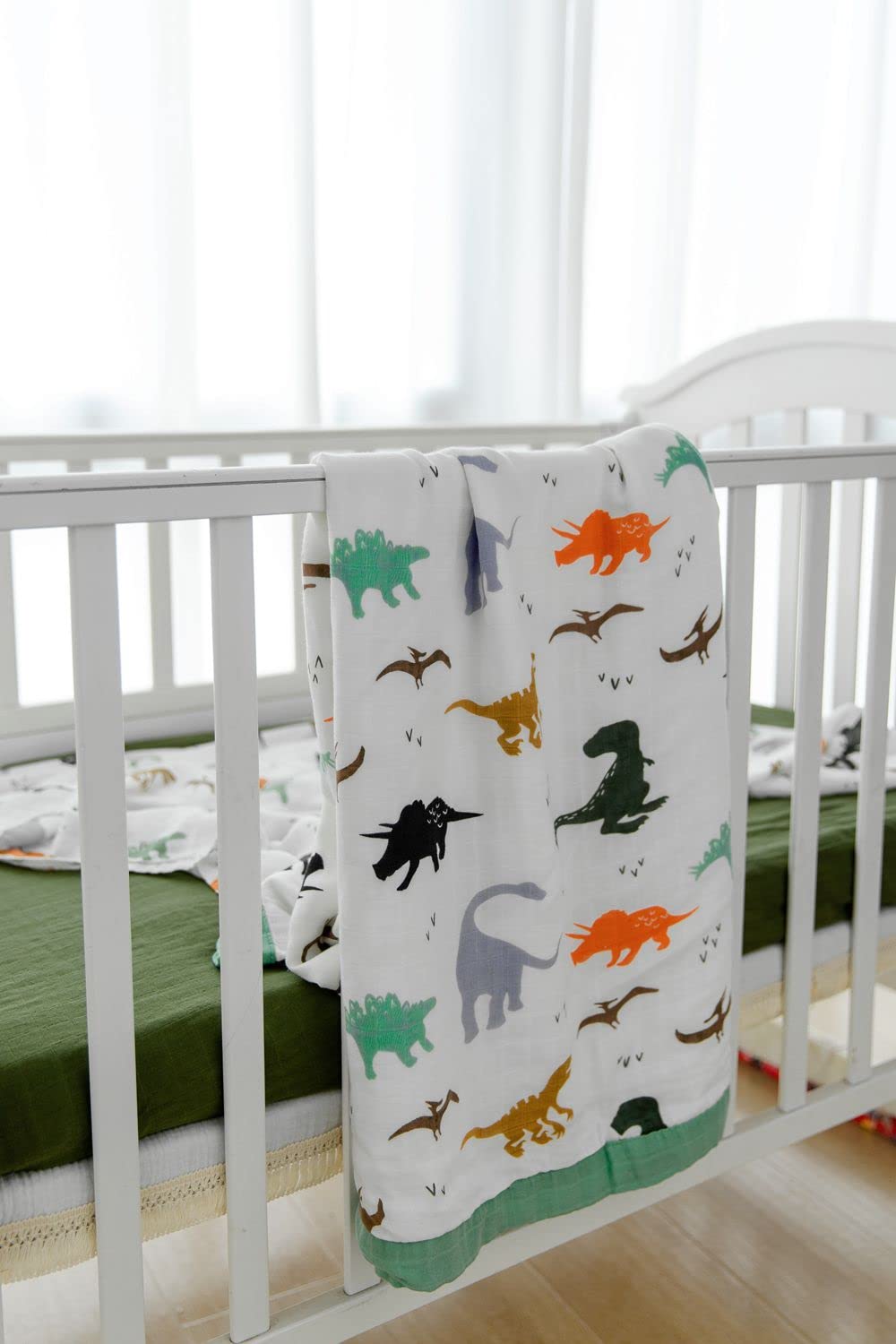 Little Jump Dinosaur Muslin Blanket large size, 47 by 47 inches.
