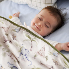 Little Jump Dinosaur Muslin Blanket nap time cozy cover in daycare settings.