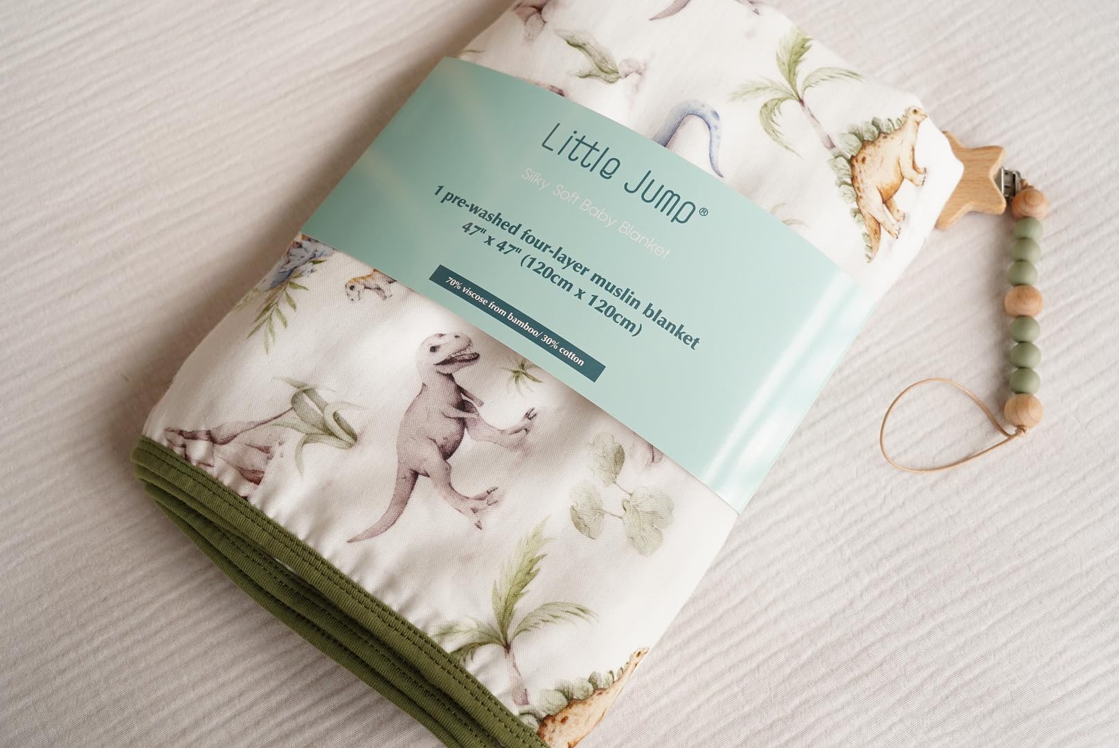 Little Jump Dinosaur Muslin Blanket soft-touch surface ideal for cuddling moments.