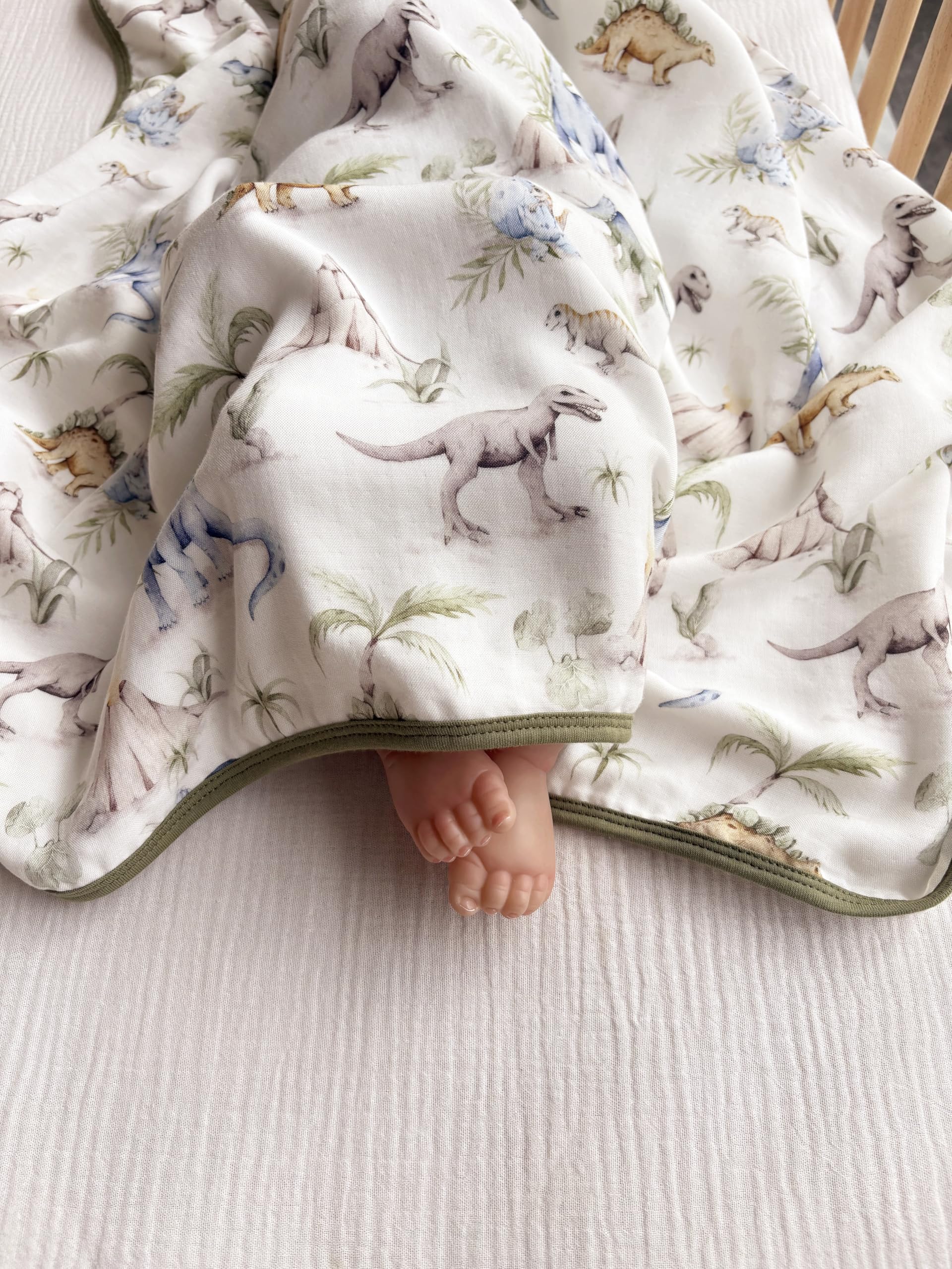 Little Jump Dinosaur Muslin Blanket stroller-ride with light coverage on outings.