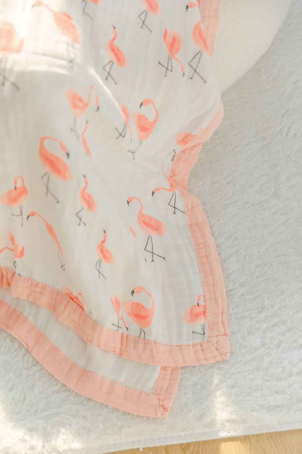Little Jump Flamingo two-layer muslin blanket provides cozy warmth without overheating.