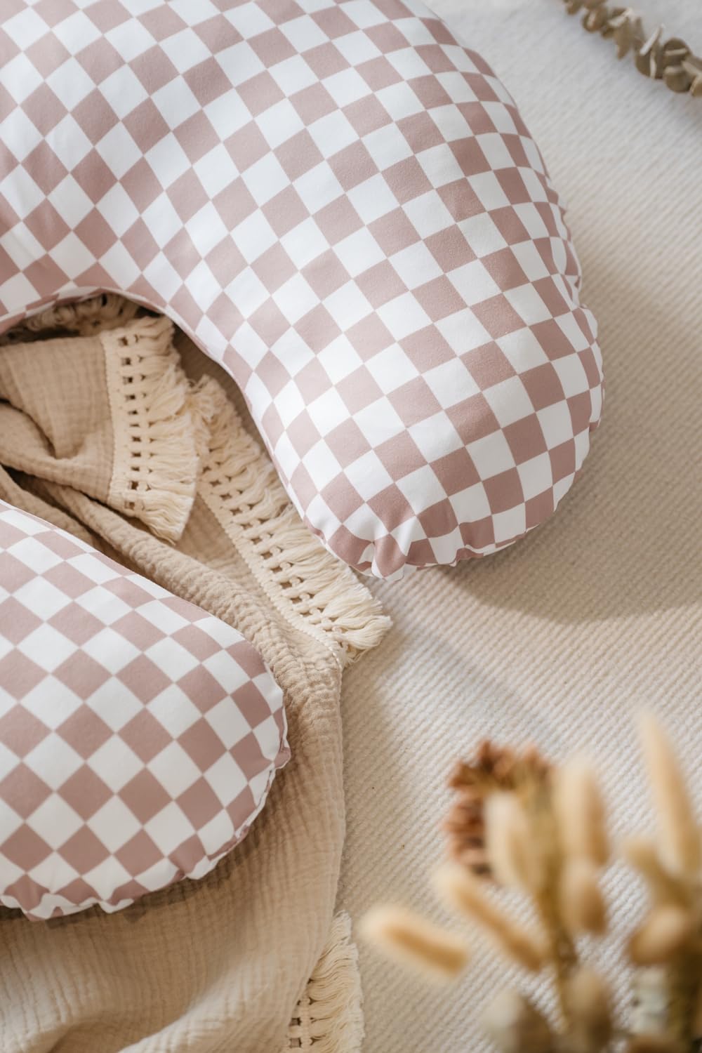 Little Jump green checkered cover protects baby's skin with zipper guard.