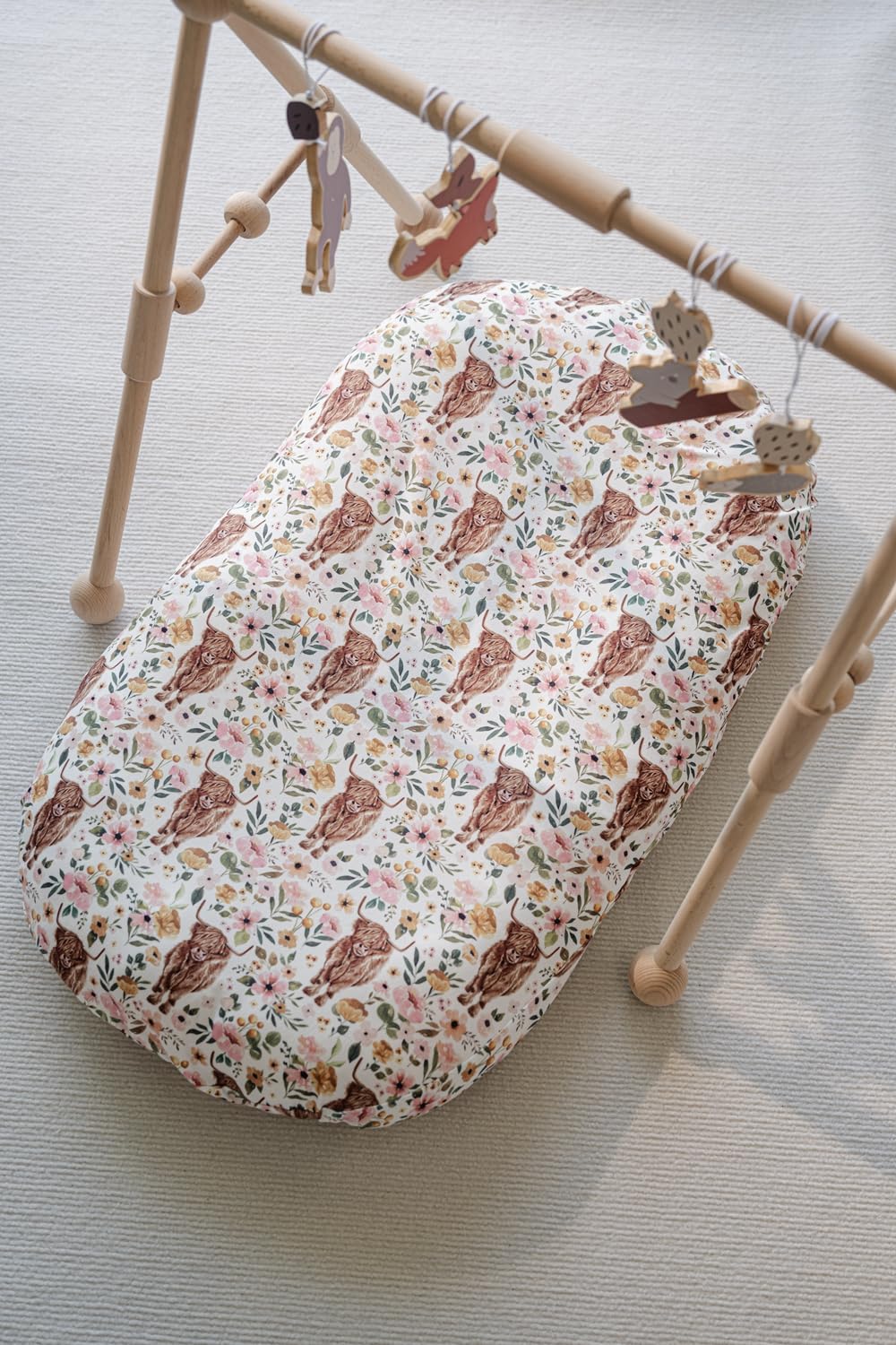 Little Jump horseshoe motif cover enhances nursery decor with western whimsy.