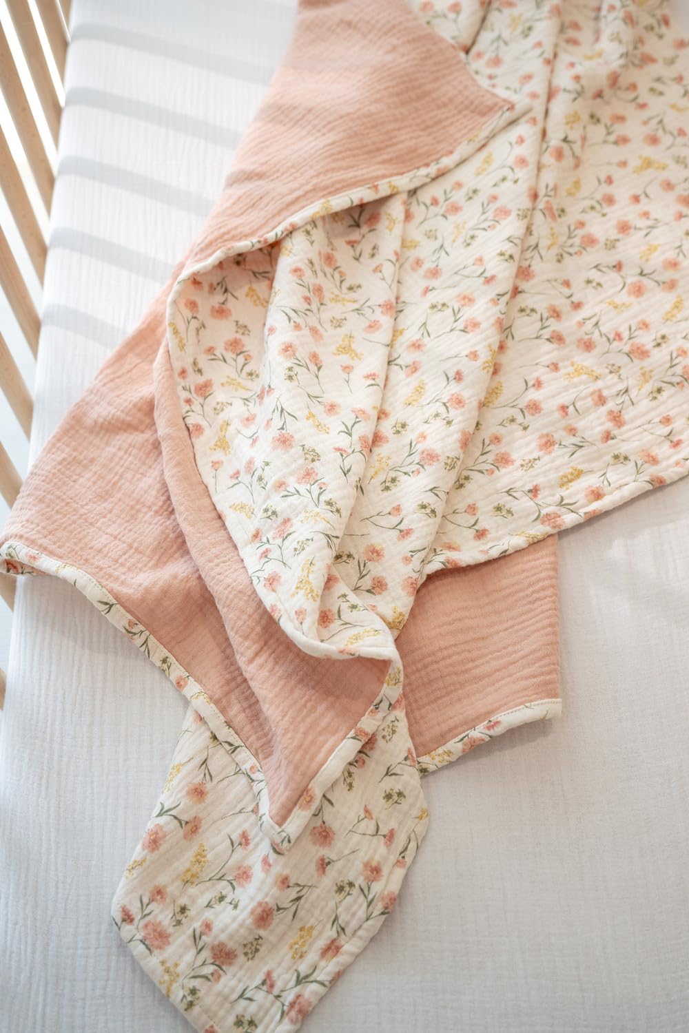 Little Jump muslin blanket serves as a soft playmat at daycare.