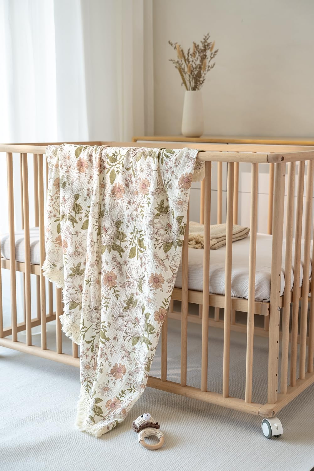 Little Jump tassel-fringe muslin blanket adds texture and charm.