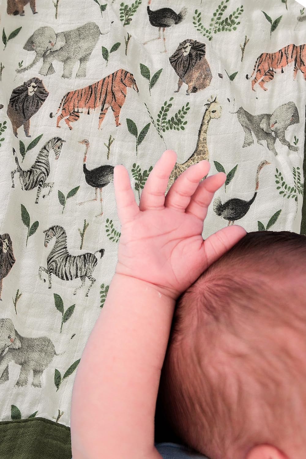 Little Jump muslin quilt stroller-ready jungle design keeps baby cozy on outings.