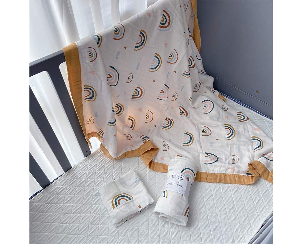Multi-use Little Jump Rainbow Muslin Quilt ready for cuddles or travel.