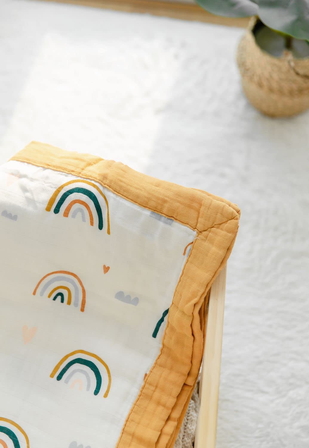 Stroller-ready Rainbow Muslin Quilt by Little Jump for outings.