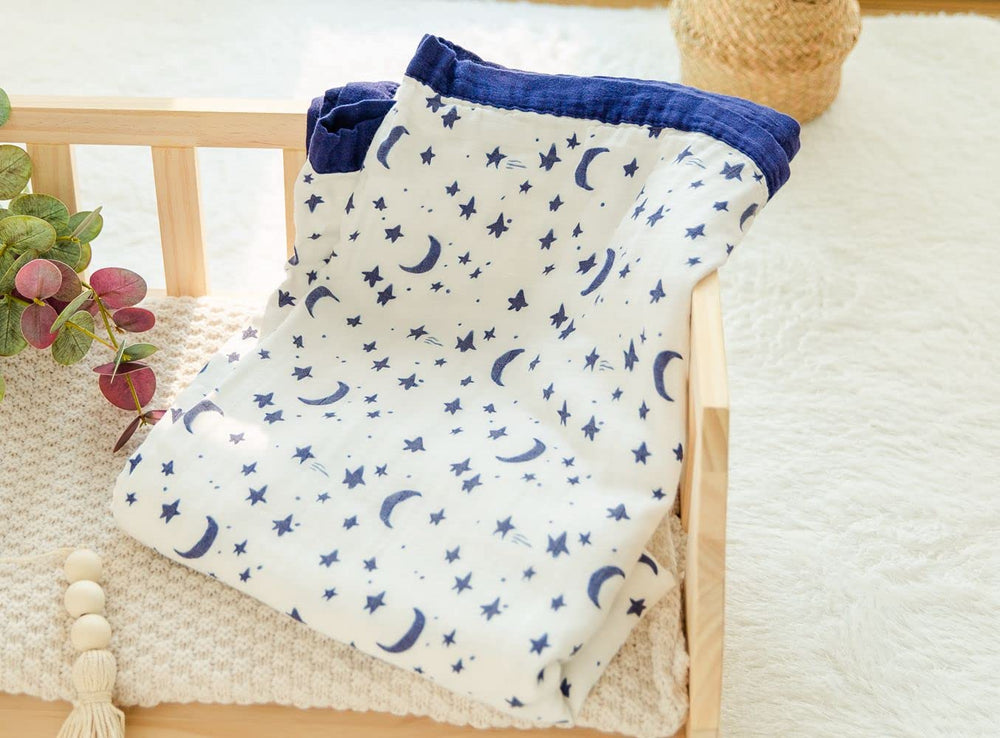Little Jump Starry Sky oversized blanket displayed on a couch for cozy lounging.