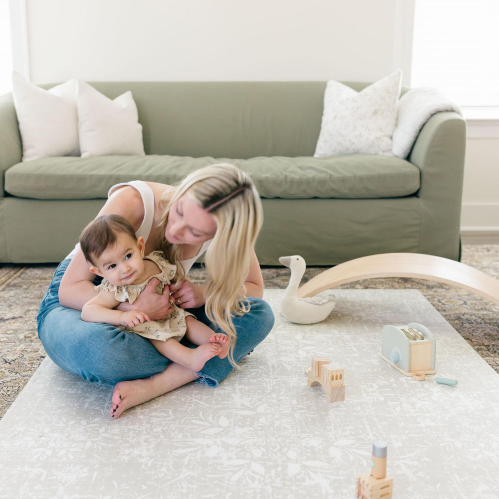 Little Landings Eden easy-to-expand puzzle mats accommodate growing play spaces.