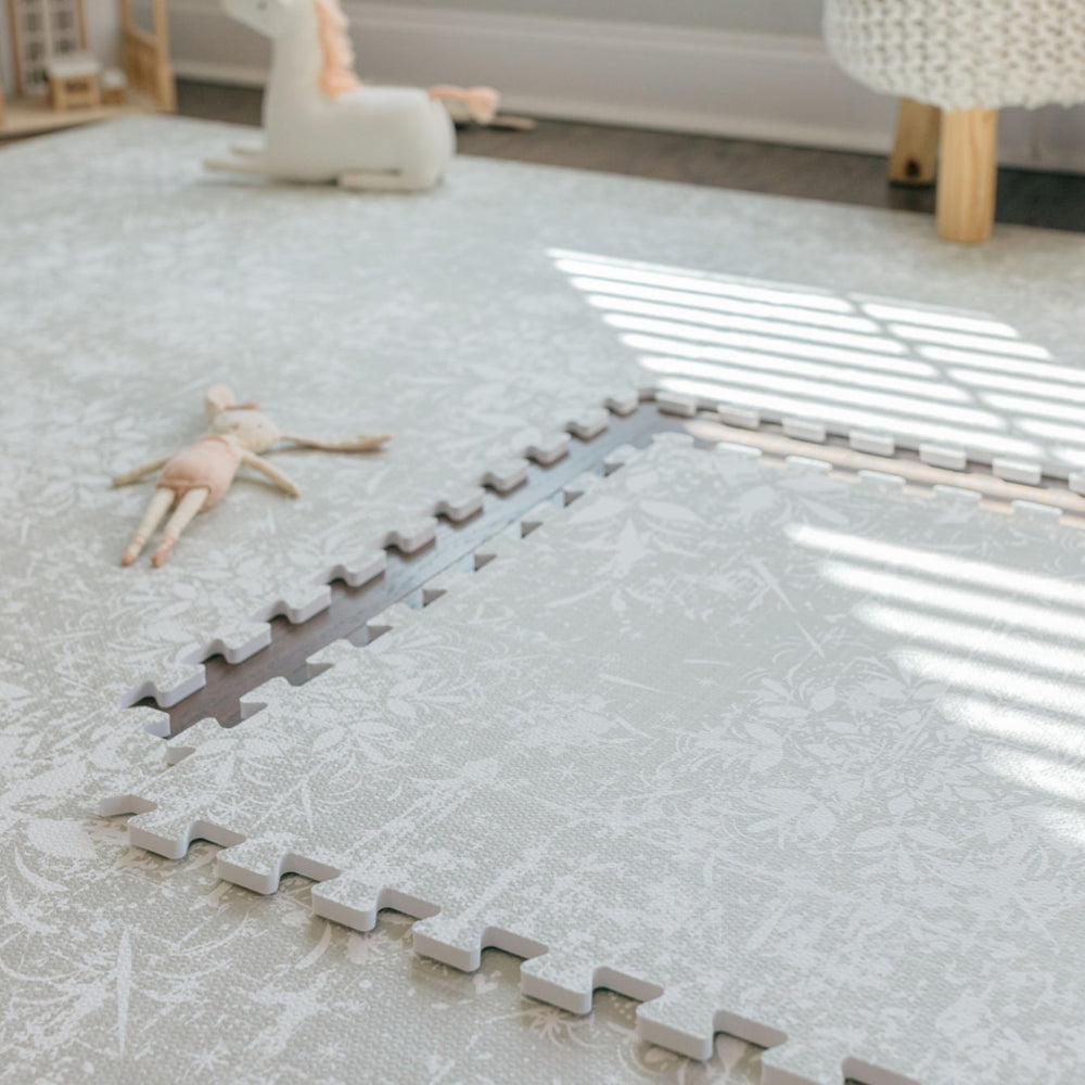 Non-slip backing keeps Eden play mat from sliding on smooth floors.