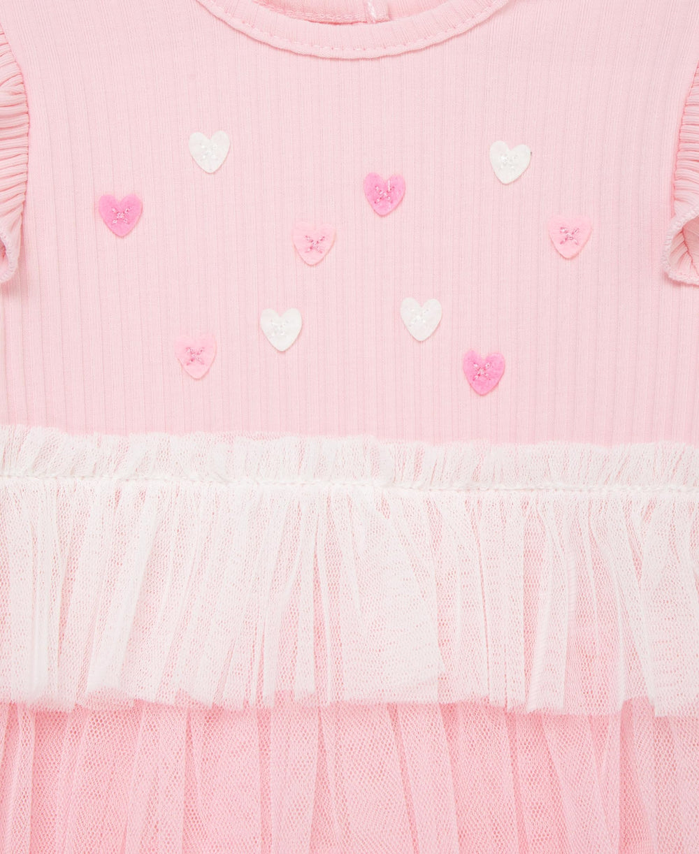 Little Me tutu snap-closure closeup for easy dressing.