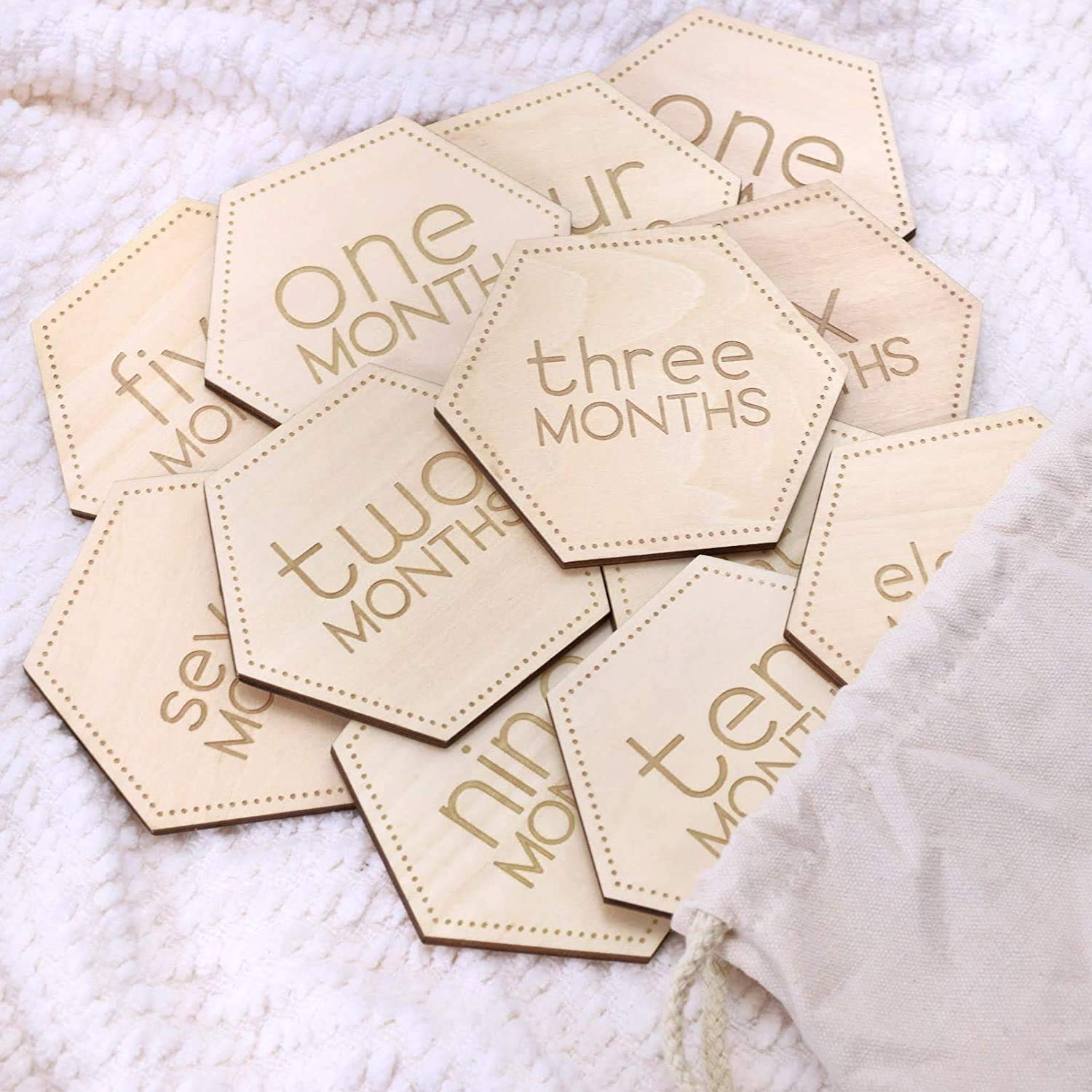 Little Moments laser engraving on natural wood texture.