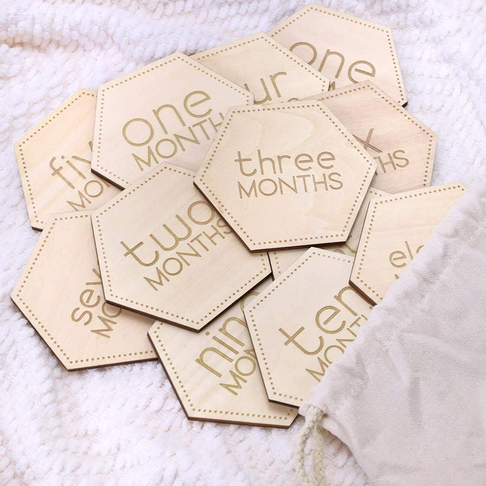 Little Moments laser engraving on natural wood texture.