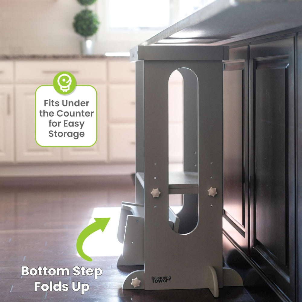 Little Partners Foldable Toddler Tower in kitchen setting promotes safe participation in cooking