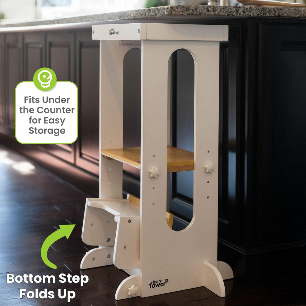 Little Partners Foldable Tower in a kitchen scene supports safe cooking and hands-on learning.