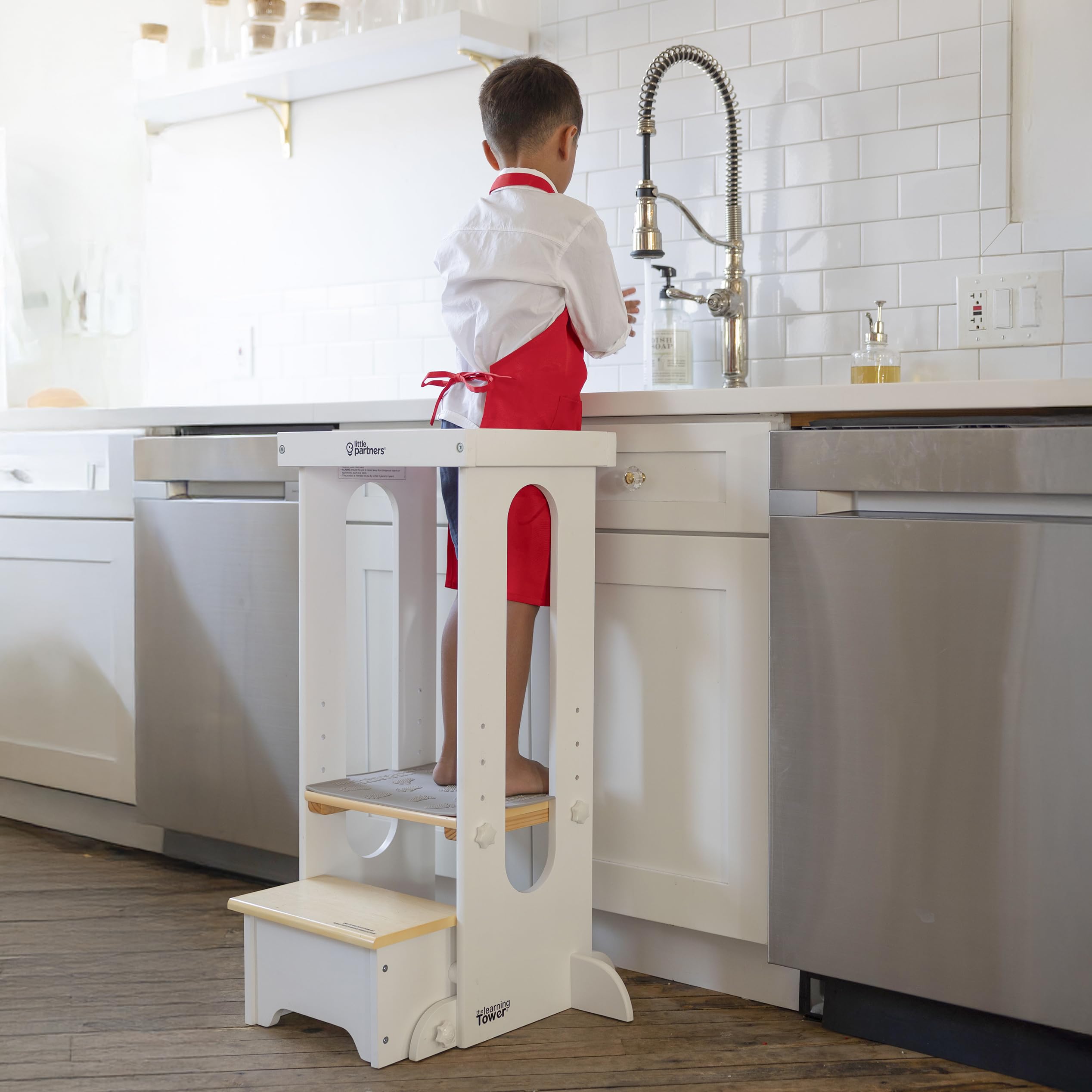 Little Partners Foldable Tower side view highlights sturdy wood and easy storage after play.