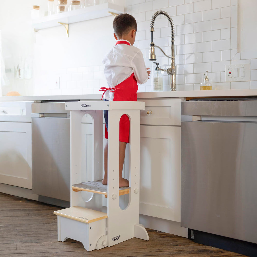 Little Partners Foldable Tower side view highlights sturdy wood and easy storage after play.
