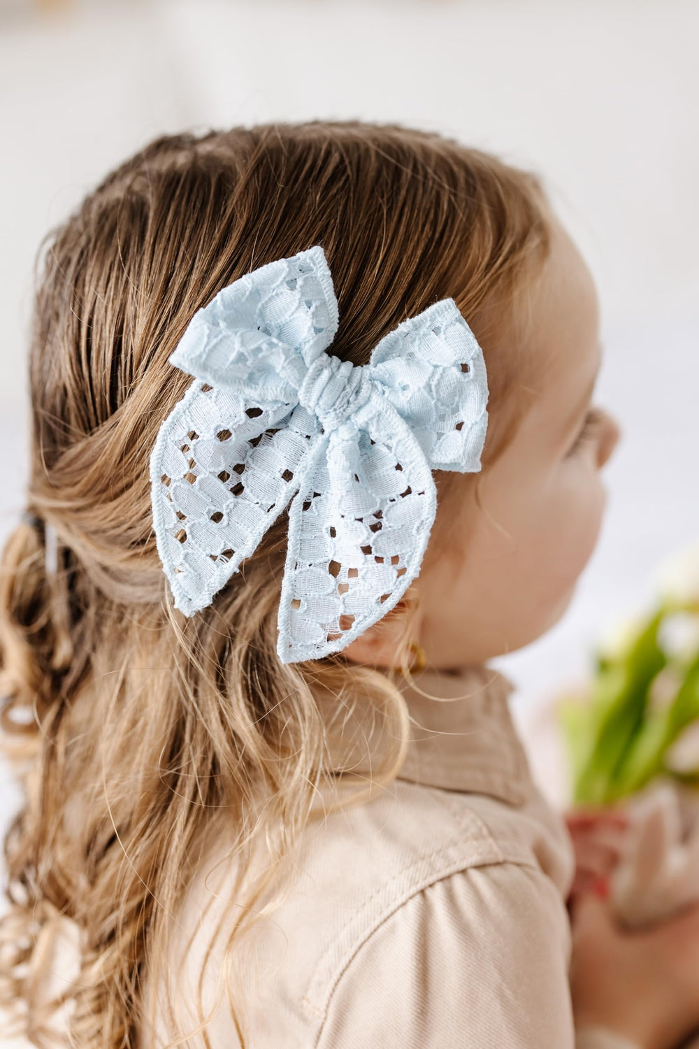 Spot-clean friendly care for Little Poppy Co bow set.