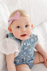 Little Poppy Co mini bows on nylon headband for comfy everyday wear.