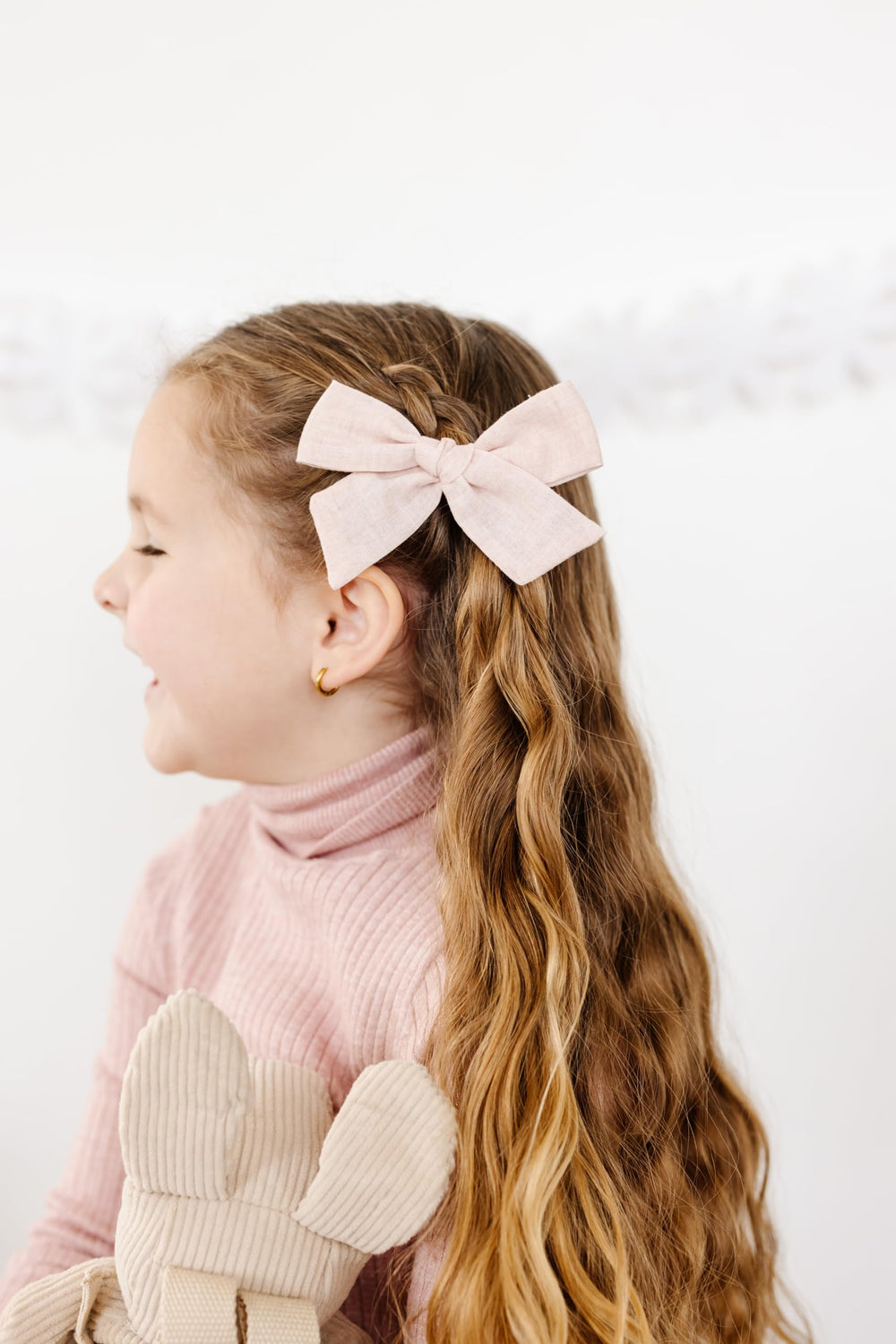 Soft-stretch nylon headband by Little Poppy Co on a baby.
