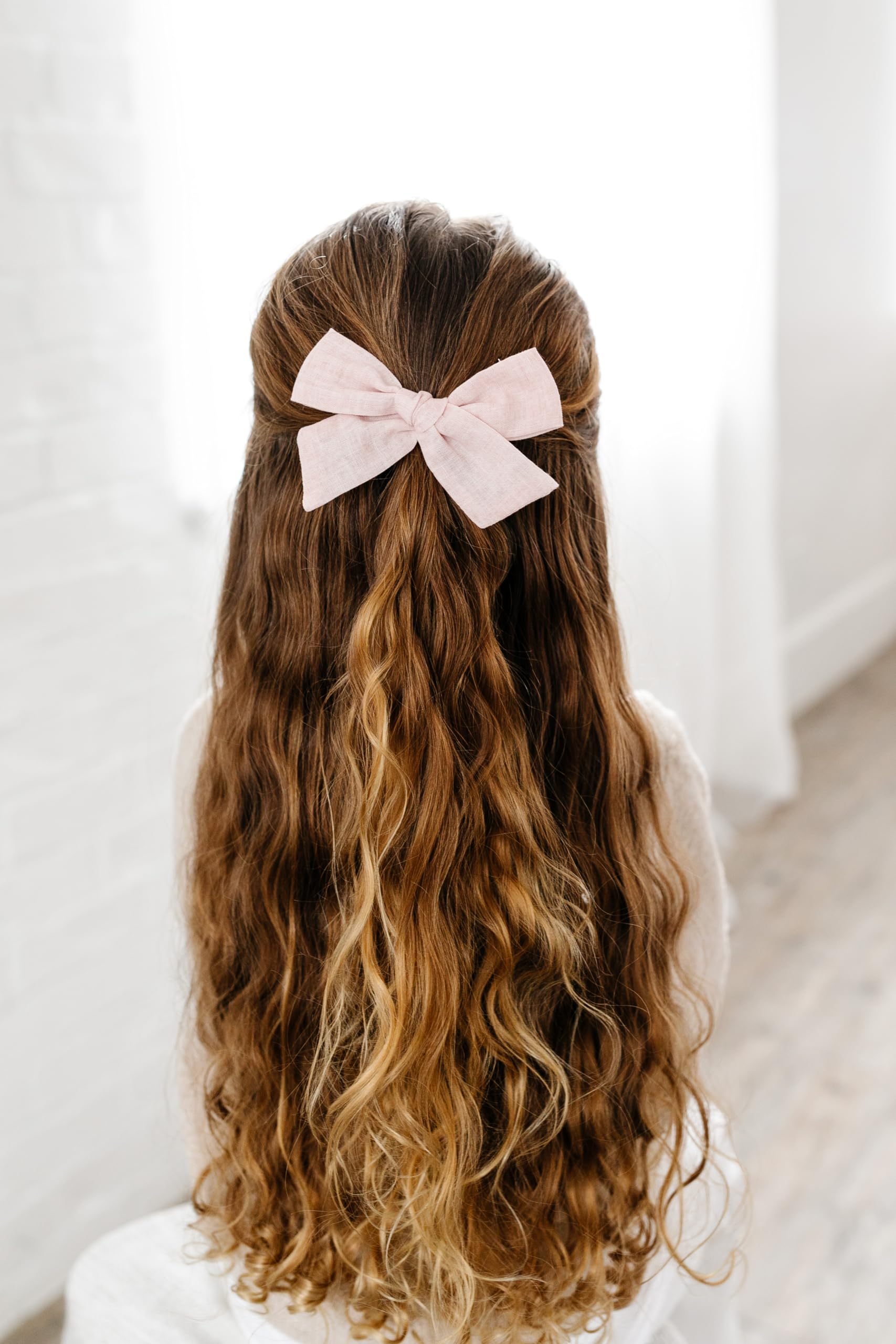 Oversized bow on reversible clip by Little Poppy Co for bold style.