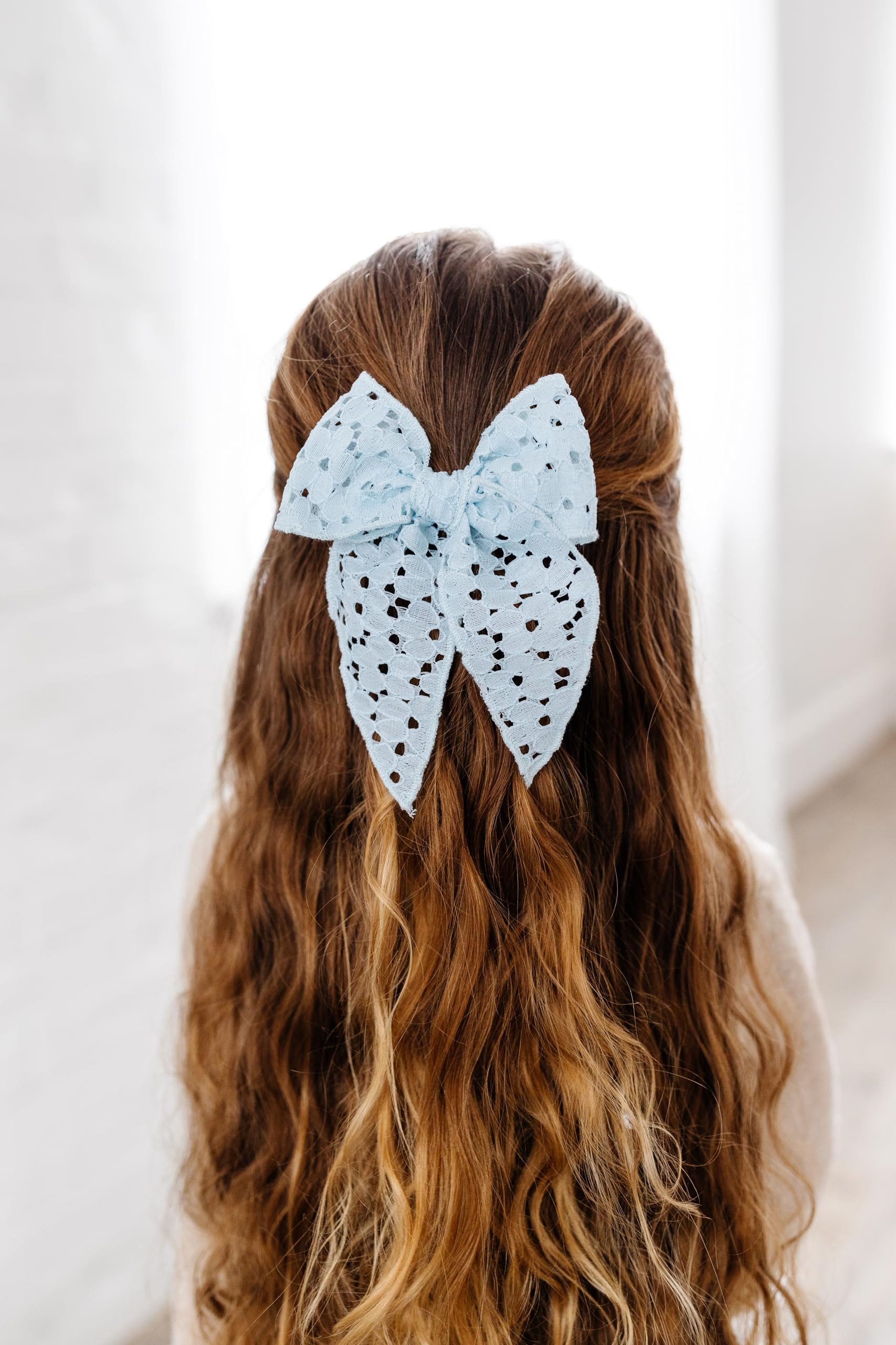 Close-up of premium fabric details in Little Poppy Co bows.