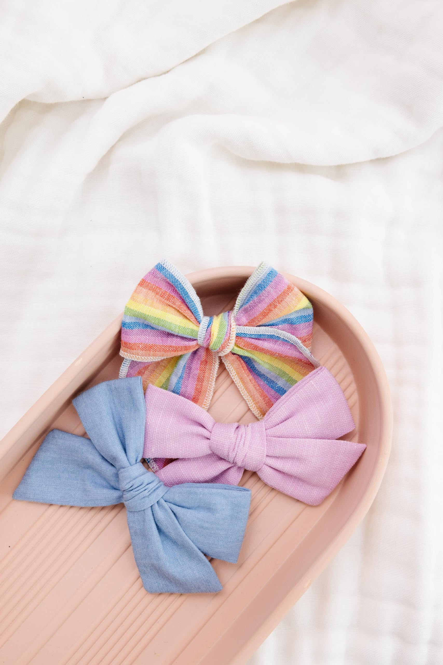 Little Poppy Co reversible alligator clip bow for versatile styling.