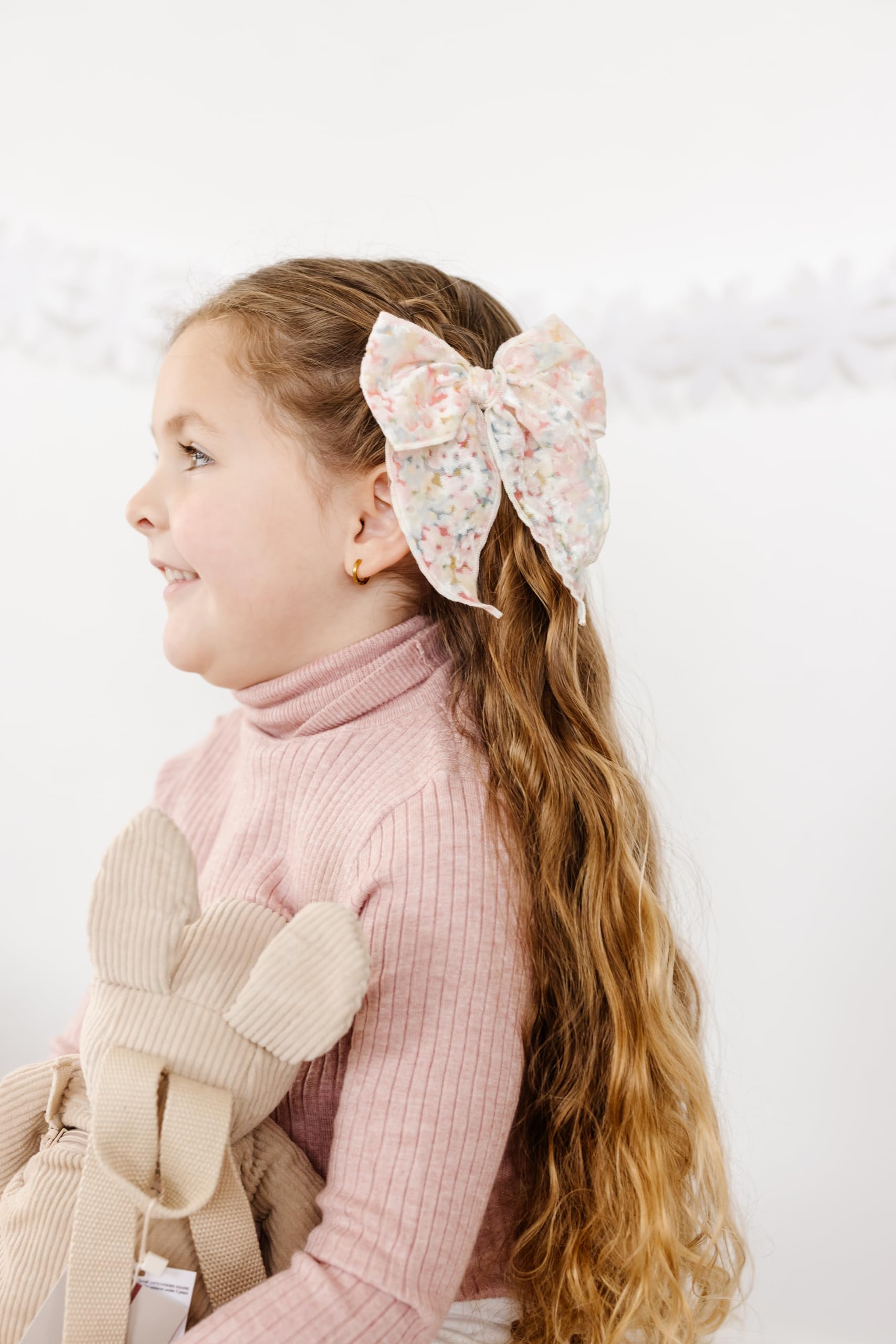 Reversible alligator clip on Little Poppy Co bows for left or right wear.