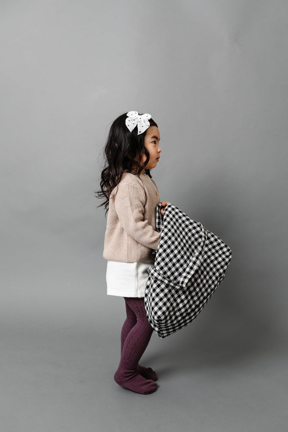 Little Poppy Co reversible clip bow design shown for side-switch convenience.