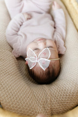 Little Poppy Co three hair bows worn on baby with nylon headband for everyday charm