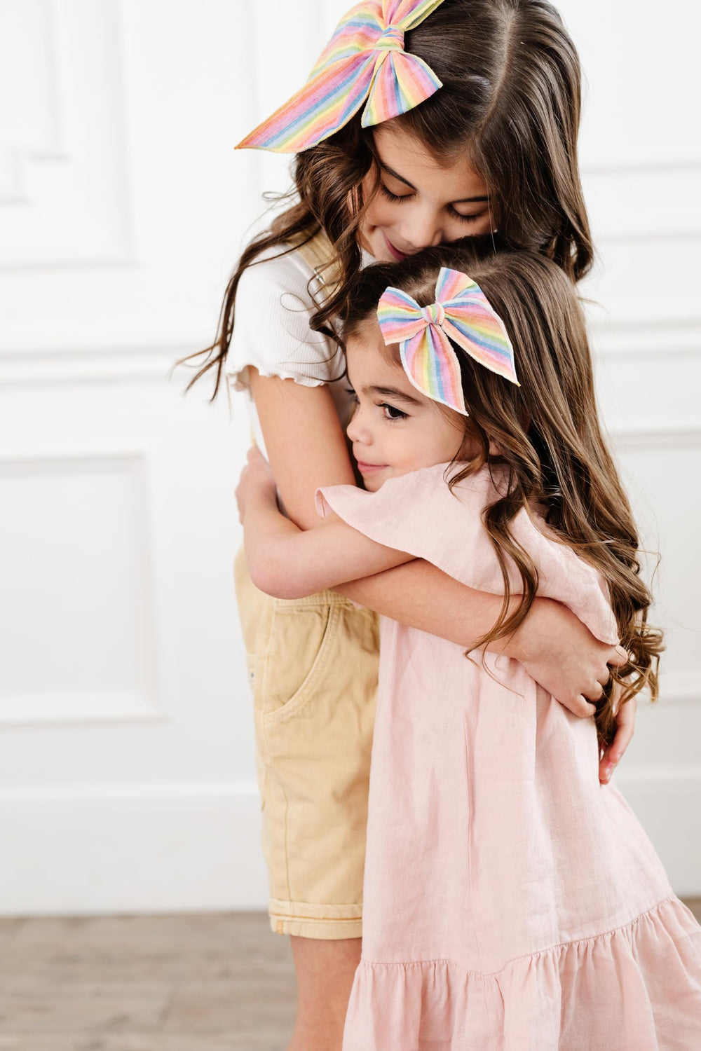 Little Poppy Co three hair bows on nylon headband offering soft, flexible fit.