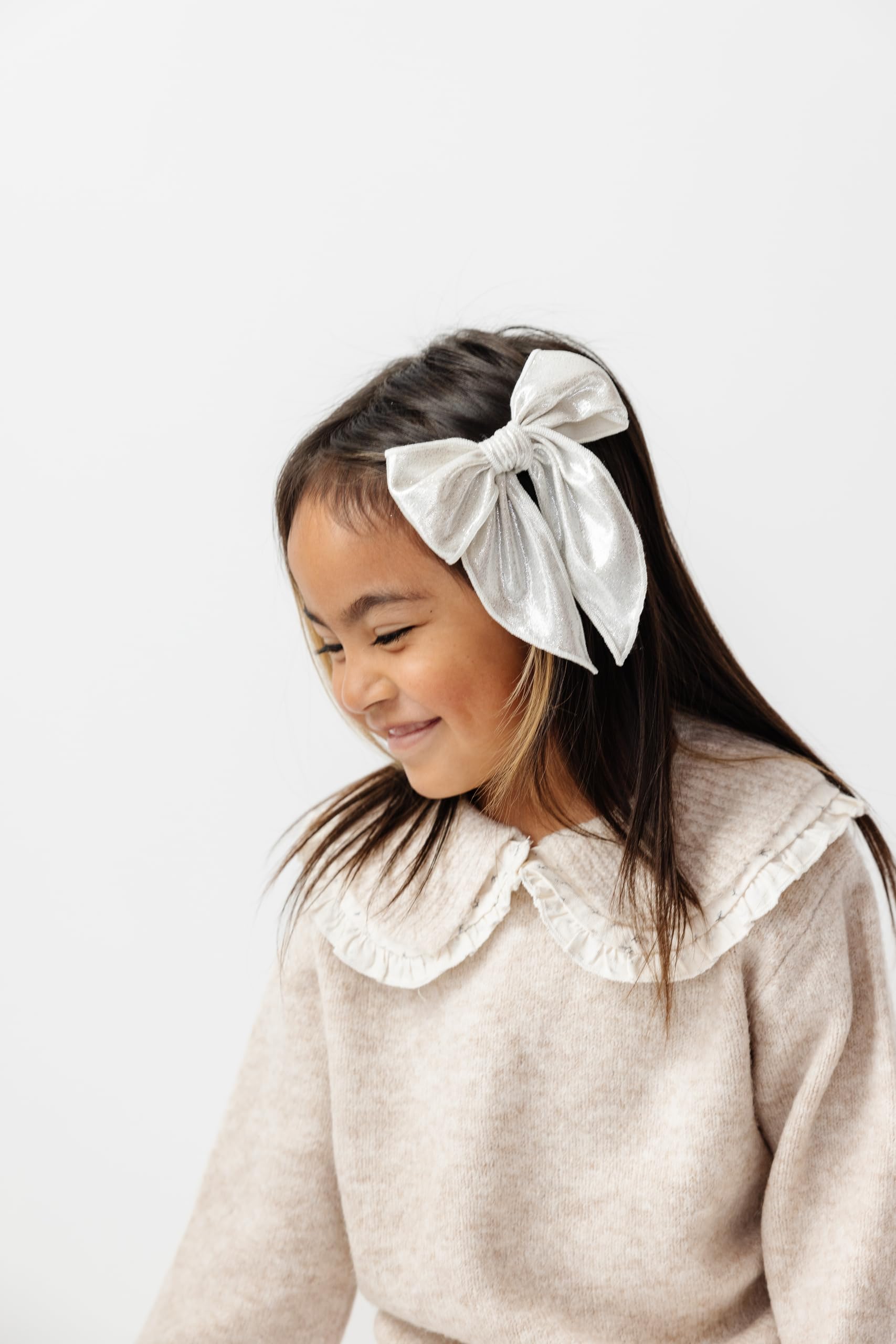 Little Poppy Co oversized bows create a bold focal point for special occasions.