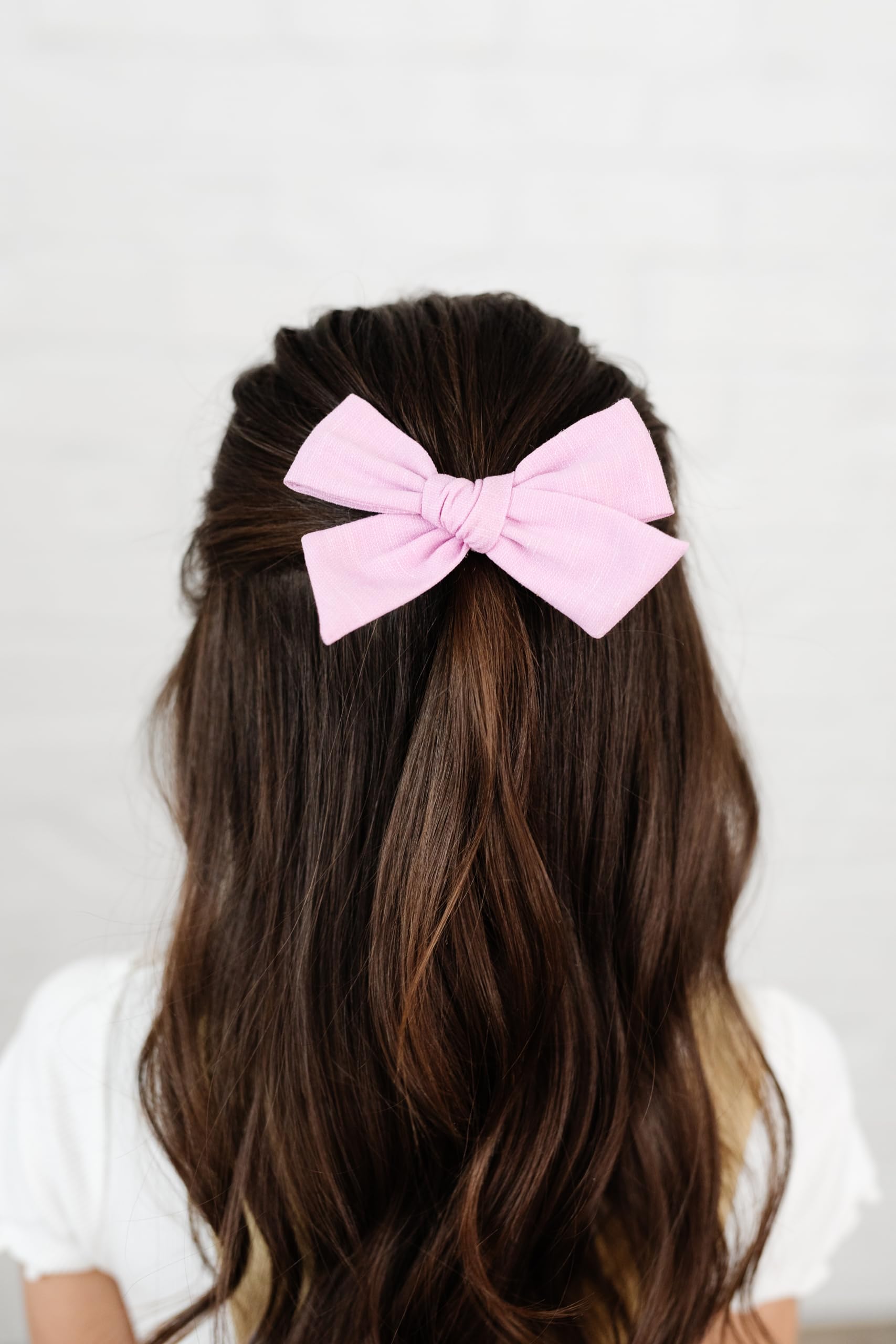 Little Poppy Co bows in premium fabric with handmade craftsmanship.
