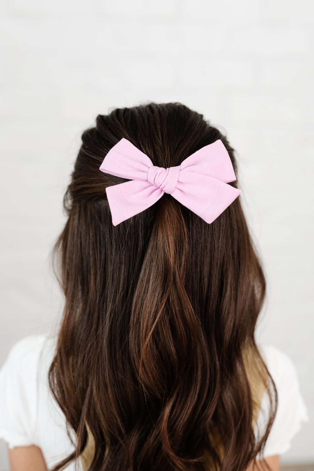 Little Poppy Co bows in premium fabric with handmade craftsmanship.