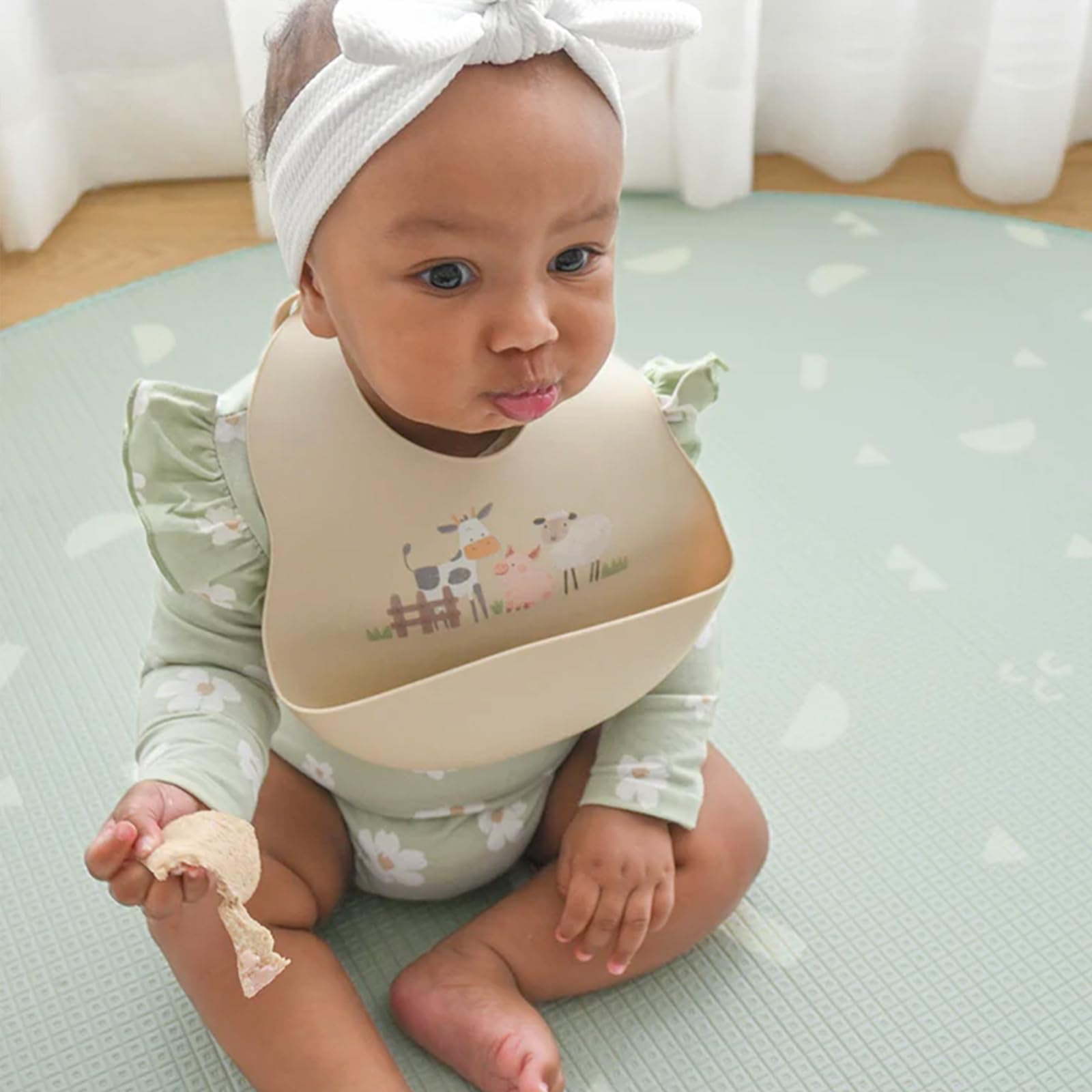 Little Rawr bib with food pouch for quick cleanup after meals